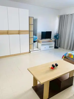 a living room with a coffee table and a tv at Pixie Happy Room Popular Condo C5 Cozy Private Room near IMPACT Muangthong in Ban Bang Phang