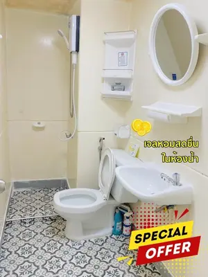 a bathroom with a toilet and a sink and a mirror at Pixie Happy Room Popular Condo C5 Cozy Private Room near IMPACT Muangthong in Ban Bang Phang