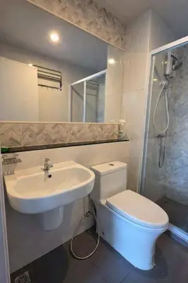 a bathroom with a toilet and a sink and a shower at A3508 Monthly Condo Skytrain Minutes away Full Kitchen and Bath! in Bangkok
