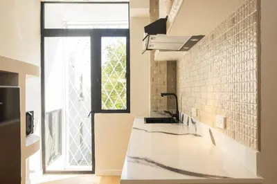 a bathroom with a sink and a window at 2 Bedroom for 4 Guests Private at Center Sathorn in Bangkok