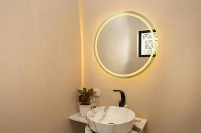 a bathroom with a sink and a mirror at 2 Bedroom for 4 Guests Private at Center Sathorn in Bangkok