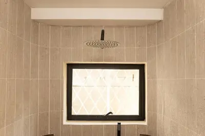 a window in the corner of a room at 2 Bedroom for 4 Guests Private at Center Sathorn in Bangkok