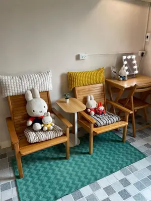 a toy room with two chairs and stuffed animals at mug & bed in Bangkok
