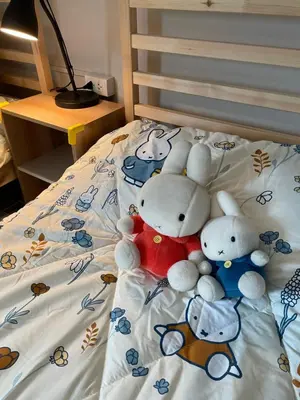 a group of stuffed animals sitting on a bed at mug & bed in Bangkok