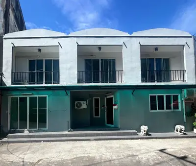 a blue and white building with a balcony at PN Apartment At Udomsuk 47
