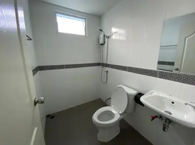 a bathroom with a toilet and a sink at PN Apartment At Udomsuk 47
