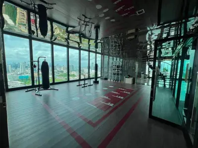 an empty room with a view of a city at New Luxury Condo 5 Min Onnut BTS - Modiz Sukhumvit 50 in Bangkok