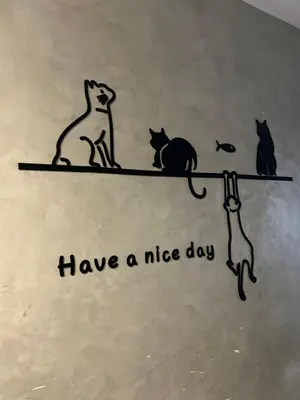 a drawing of three cats sitting on a tree branch at Lesbase Women Hostel in Bangkok
