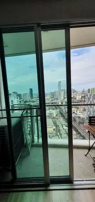 a view of a city from an office window at Sky Walk Condo Spacious 2BR Near BTS Phra Khanong in Bangkok
