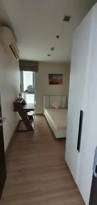 a bedroom with a bed and a desk and a table at Sky Walk Condo Spacious 2BR Near BTS Phra Khanong in Bangkok