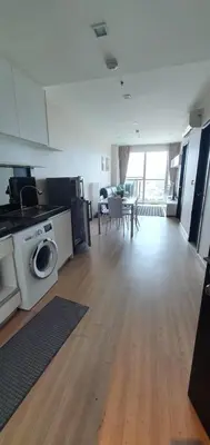a large room with a kitchen and a living room at Sky Walk Condo Spacious 2BR Near BTS Phra Khanong in Bangkok