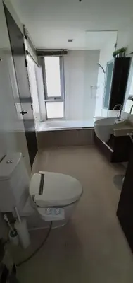 a bathroom with a toilet and a sink at Sky Walk Condo Spacious 2BR Near BTS Phra Khanong in Bangkok