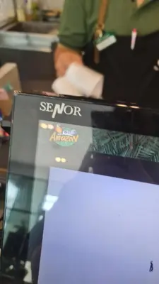 a laptop computer sitting on top of a table at Lionkey in Taling Chan