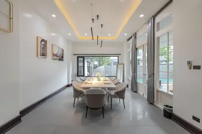 a dining room with a table and chairs at Thong Lo Luxury Pool Villa In Center Of Bangkok in Bangkok