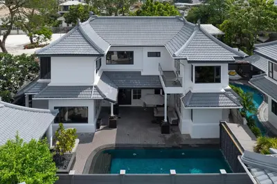 an aerial view of a house with a swimming pool at Thong Lo Sumptuous Double Pool Villa in Bangkok