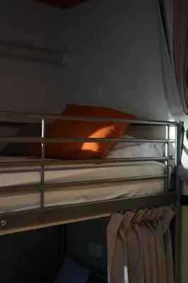 a couple of bunk beds in a room at Nitra Hostel Siriraj in Bangkok