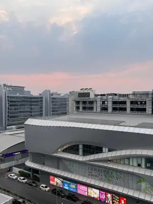 an airport with cars parked in front of it at CT Impact in Thung Si Kan