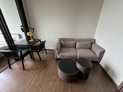 a living room with a couch and a table at High Rise Designer Gem Central Bangkok City View in Bangkok