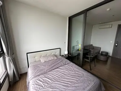 a bedroom with a bed and a desk in it at High Rise Designer Gem Central Bangkok City View in Bangkok