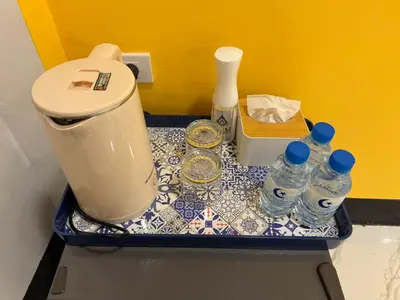 a tray with water bottles and a blender on a counter at Siam Boutique Hotel in Bangkok
