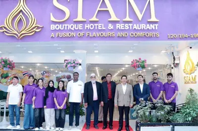a group of people posing for a picture in front of a hotel at Siam Boutique Hotel in Bangkok