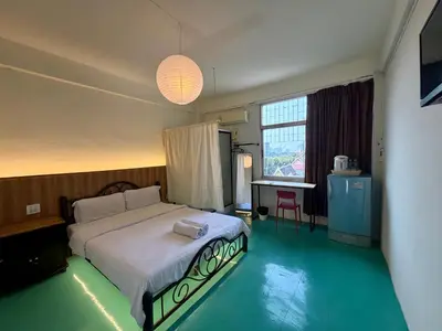 a bedroom with a large bed in a room at arakhouse อารักษ์เฮ้าส์ in Godown