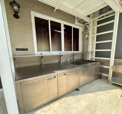 a kitchen with a sink and a window at Residence at 49 in Bangkok