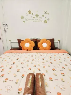 two teddy bears sitting on top of a bed at 707-STP Homely room Free Wi-Fi and Near BTS in Sathani Bang Khen