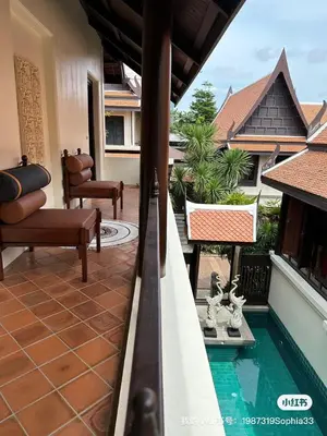 a balcony with a swimming pool in a house at CBD Private Pool Villa Nanny Free Thai costumes 24hrs Security Breakfast in Bangkok