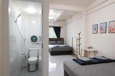 a bathroom with a toilet and a shower and a bed at ดอนเมือง 301 Near DMK Airport BTS Wat PhraSi in Bang Khen