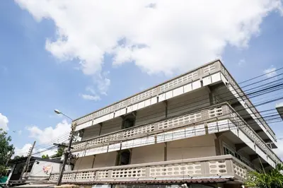 a building with white balconies against a blue sky at ดอนเมือง 301 Near DMK Airport BTS Wat PhraSi in Bang Khen