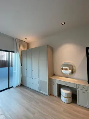 a room with a dressing table and a mirror at 89 Residence Ratchada - Rama 9 in Ban Na Song