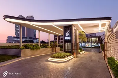 a gas station with a sign on it at 89 Residence Ratchada - Rama 9 in Ban Na Song