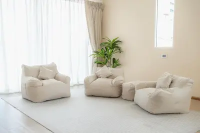 two white chairs sitting in a living room at Stay Ekkamai - Private Pool villa, Central Bangkok in Bangkok