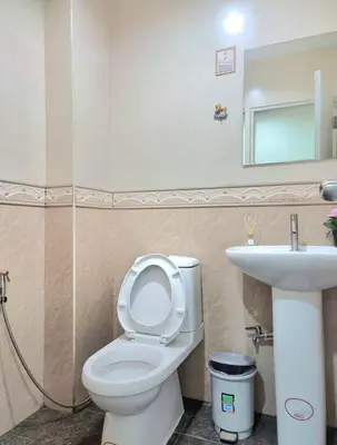 a bathroom with a toilet and a sink at 38 House Don Mueang Airport BTS Wat Phrasi in Bang Khen