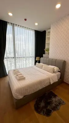 a large bed in a room with a large window at 2BR Apartment near SiamPlatinumCentral World in Bangkok