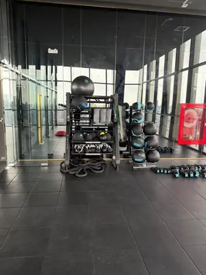 a gym with a bunch of dumbbells in a room at 2BR Apartment near SiamPlatinumCentral World in Bangkok