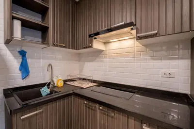 a kitchen with a sink and a counter top at Hangover State Tower Stunning River View in Bangkok