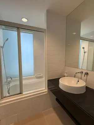 a bathroom with a sink and a window at Ideo Mix Sukhumvit 103, right next to BTS Udomsuk in Phra Khanong