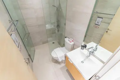 a bathroom with a shower and a sink and a toilet at Heart \u7d20\u5764\u903836 Chewaheart Sukhumvit 36 in Bangkok
