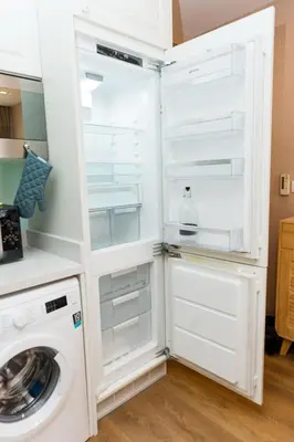 a white refrigerator with a washing machine in it at Lux Condo 2BR - 5 mins walk to BTS Phrom Phong in Bangkok