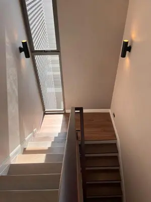 a stairway with a skylight and a window at Luxury Villa 4BR - 8 Mins to Thonglor BTS in Bangkok