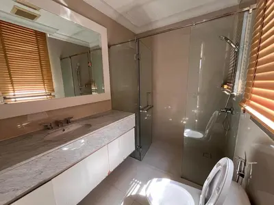a bathroom with a shower and a toilet and a sink at Luxury private swimming pool house for 10pax in Bangkok