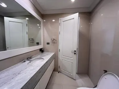 a bathroom with a sink and a mirror and a toilet at Luxury private swimming pool house for 10pax in Bangkok