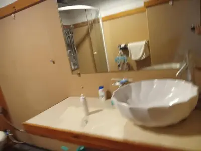 a bathroom with a sink and a mirror at Spacious City-View Apartment with Modern Amenities in Krung Thep in Amphoe Phra Khanong