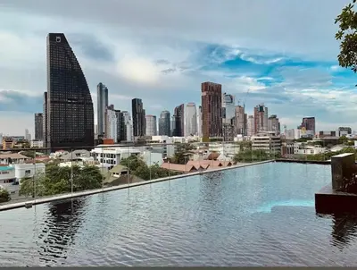 a large pool of water in front of a city at Perfect WFH 5 mins THONG LOR ultra luxury in Bangkok