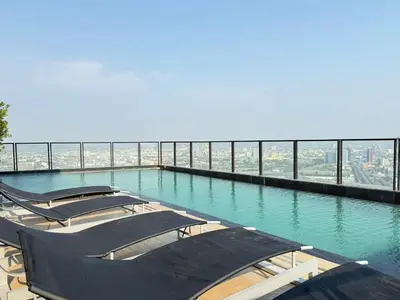 a row of boats in a pool on a building at Bangkok Rama9 Cassia & Siamese in Bangkok