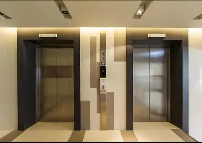 two elevators in a lobby of a building at Designer Home BTS bangkok centre Pool Gym