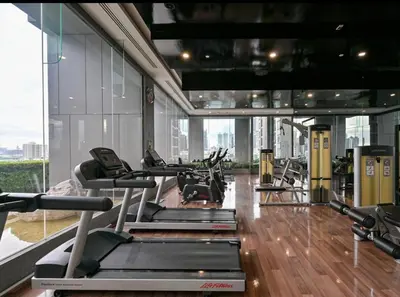 a gym with cardio equipment in a building at Thonglor BTS Prime Pool gym Netflix city in Bangkok