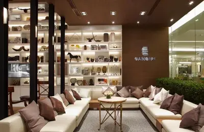 a store with white couches and a shelf with shoes at Thonglor BTS Prime Pool gym Netflix city in Bangkok